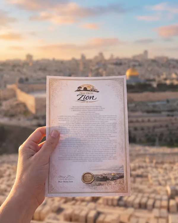 A Pray From Zion prayer held up at Mount of Olives