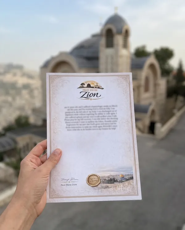 A Pray From Zion prayer held up at St. Peter in Gallicantu